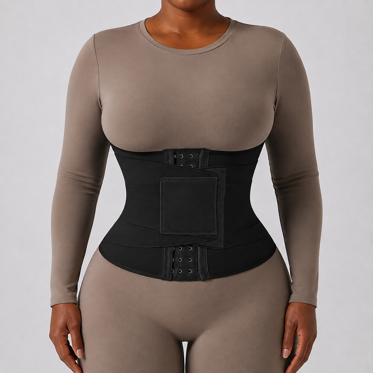 The Wrap Waist Trainer in black, with an adjustable wrap closure