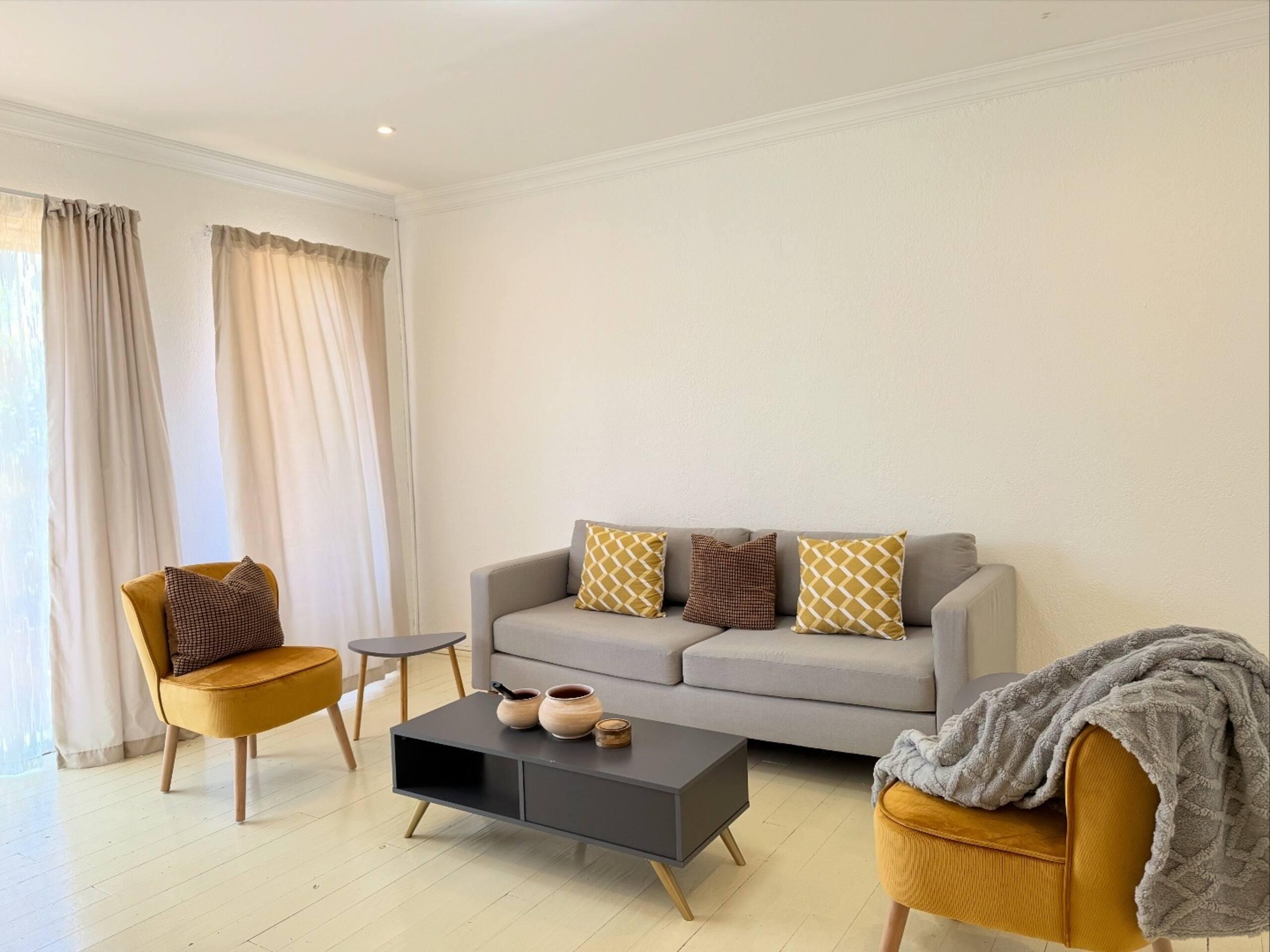 Living room of a Fayn Bodywear branded residence, dressed in soft neutral tones